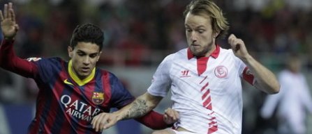 Barcelona a iesit invingatoare din ploaia de la Sevilla